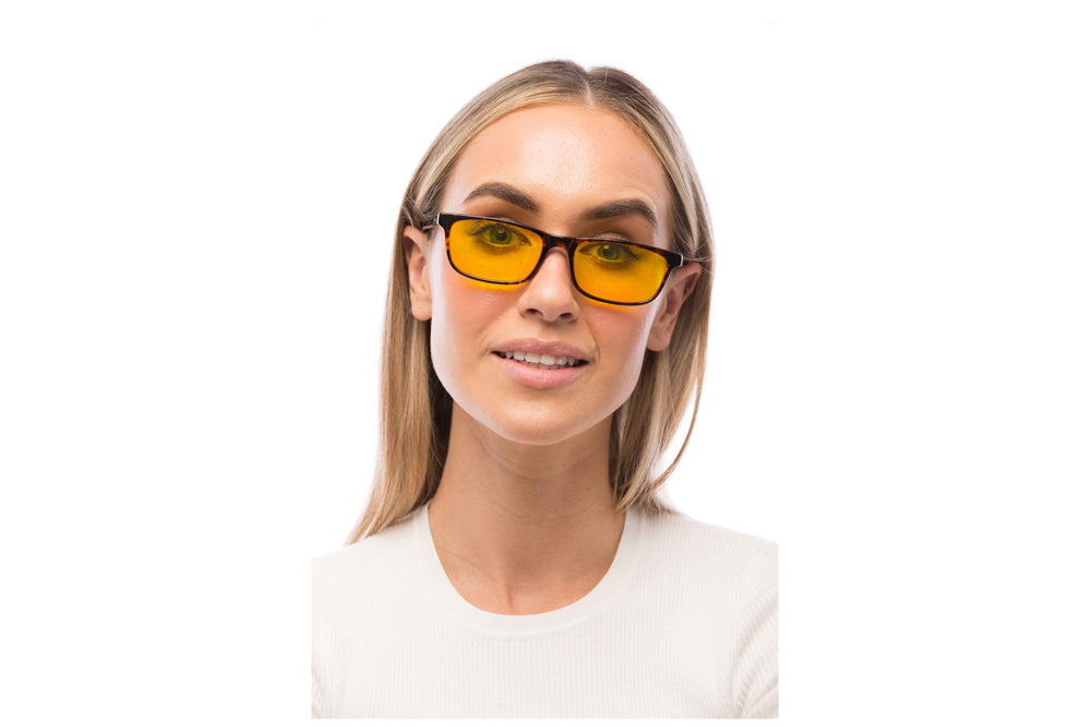 Woman Wearing Tortoise Shell Light Sensitivity Glasses Readers