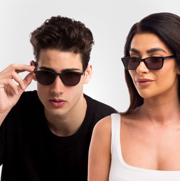 Male and female wearing a pair of Biohacked Sunglasses